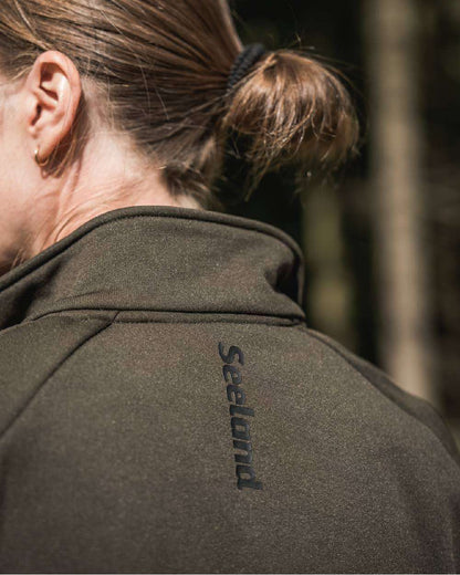 Pine Green Coloured Seeland Womens Tidal Tora Fleece Jacket on outdoor background 