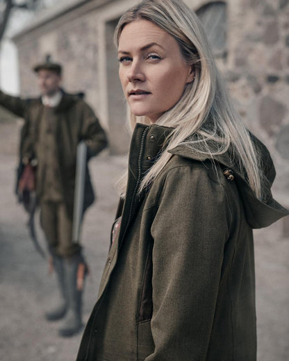 Shaded Olive coloured Seeland Woodcock Advanced Ladies Jacket on outdoor background 