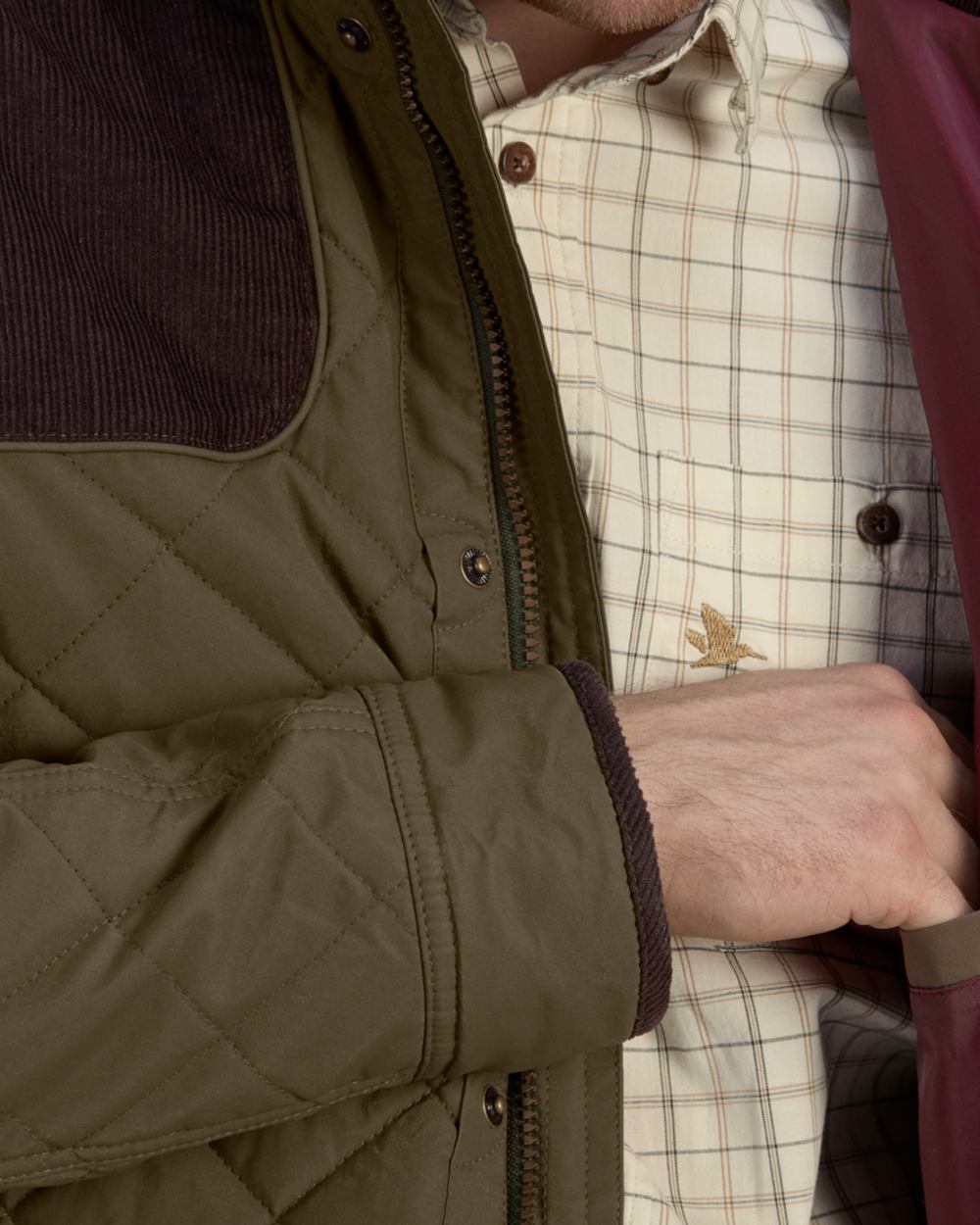 Shaded Olive Coloured Seeland Woodcock Advanced Quilted Jacket on White background 