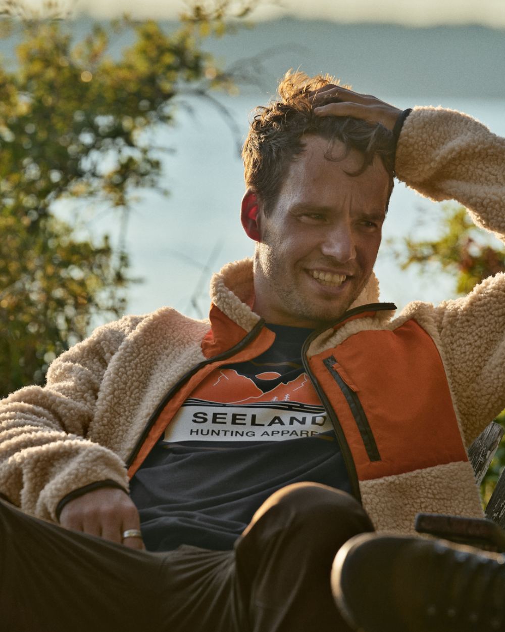 Sandshell Coloured Seeland Zephyr Fleece Jacket on lake background 