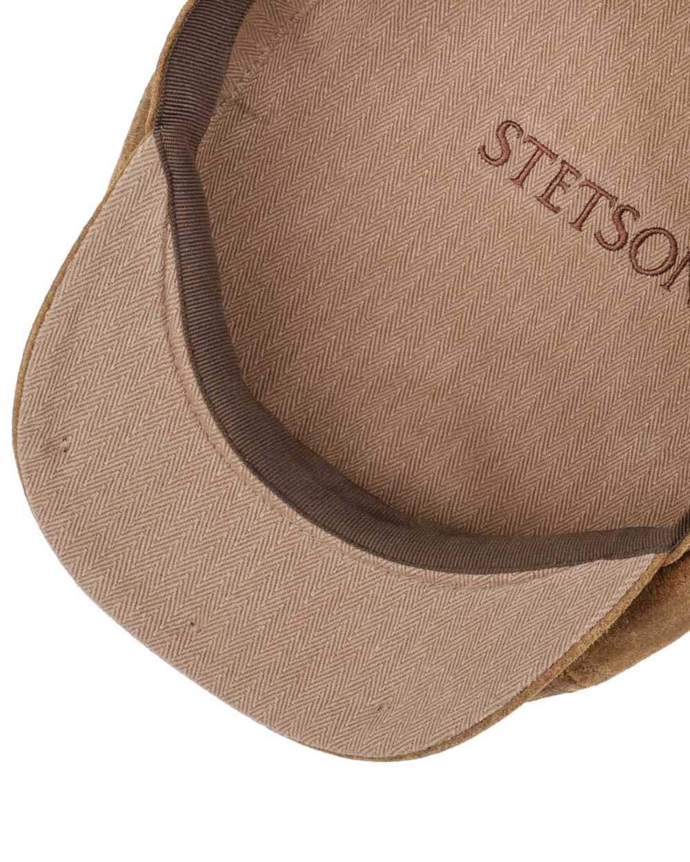 Brown coloured Stetson 6 Panel Vintage Pigskin Flat Cap on white background 