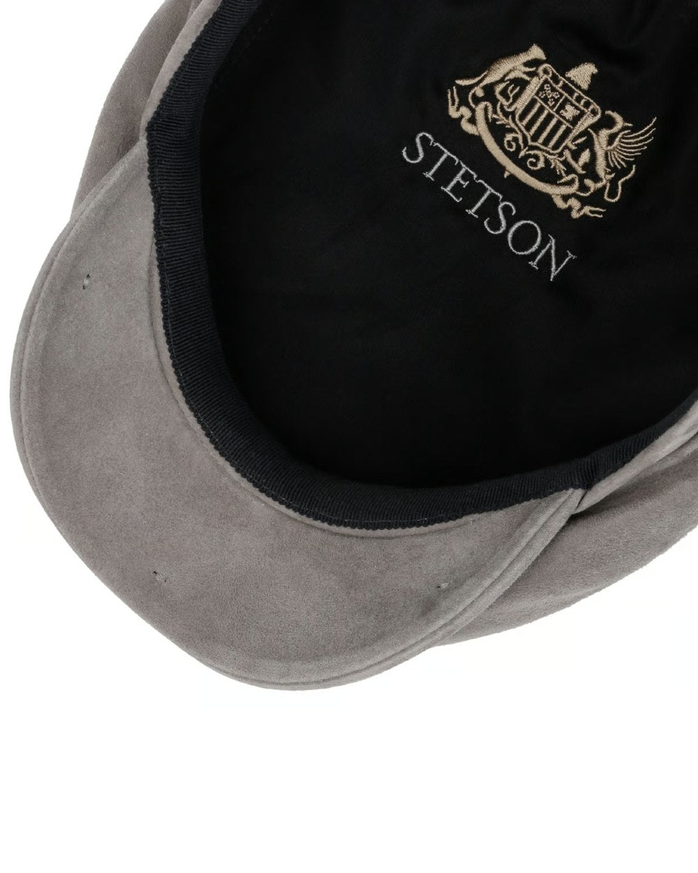Silver coloured Stetson Driver Goat Suede Cap on white background 