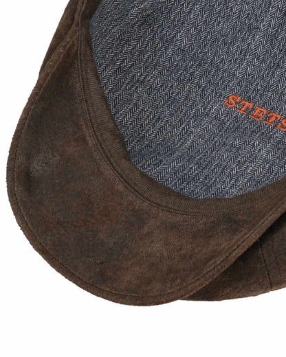 Chocolate coloured Stetson Hatteras Pigskin Leather Cap on white background 