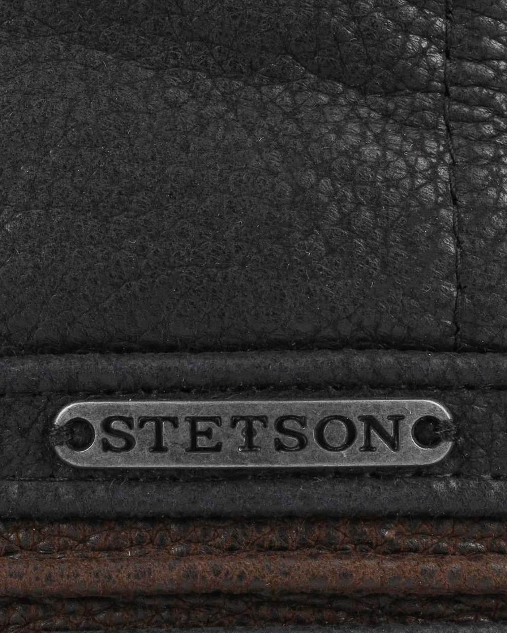 Black Brown coloured Stetson Redding Earflap Cap on white background 