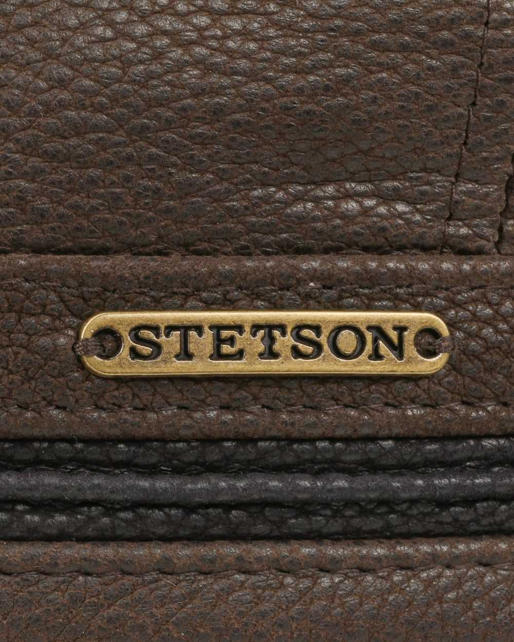 Brown Black coloured Stetson Redding Earflap Cap on white background 