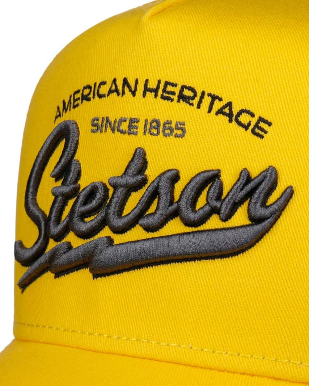Yellow coloured Stetson American Heritage Trucker Cap on white background 