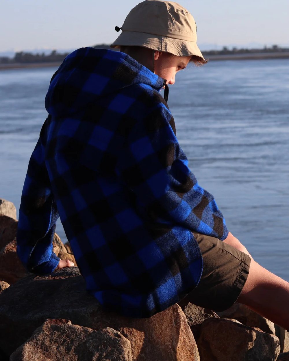 Blue Black Check Coloured Swanndri Kids Brixton Wool Bushshirt on sea background 