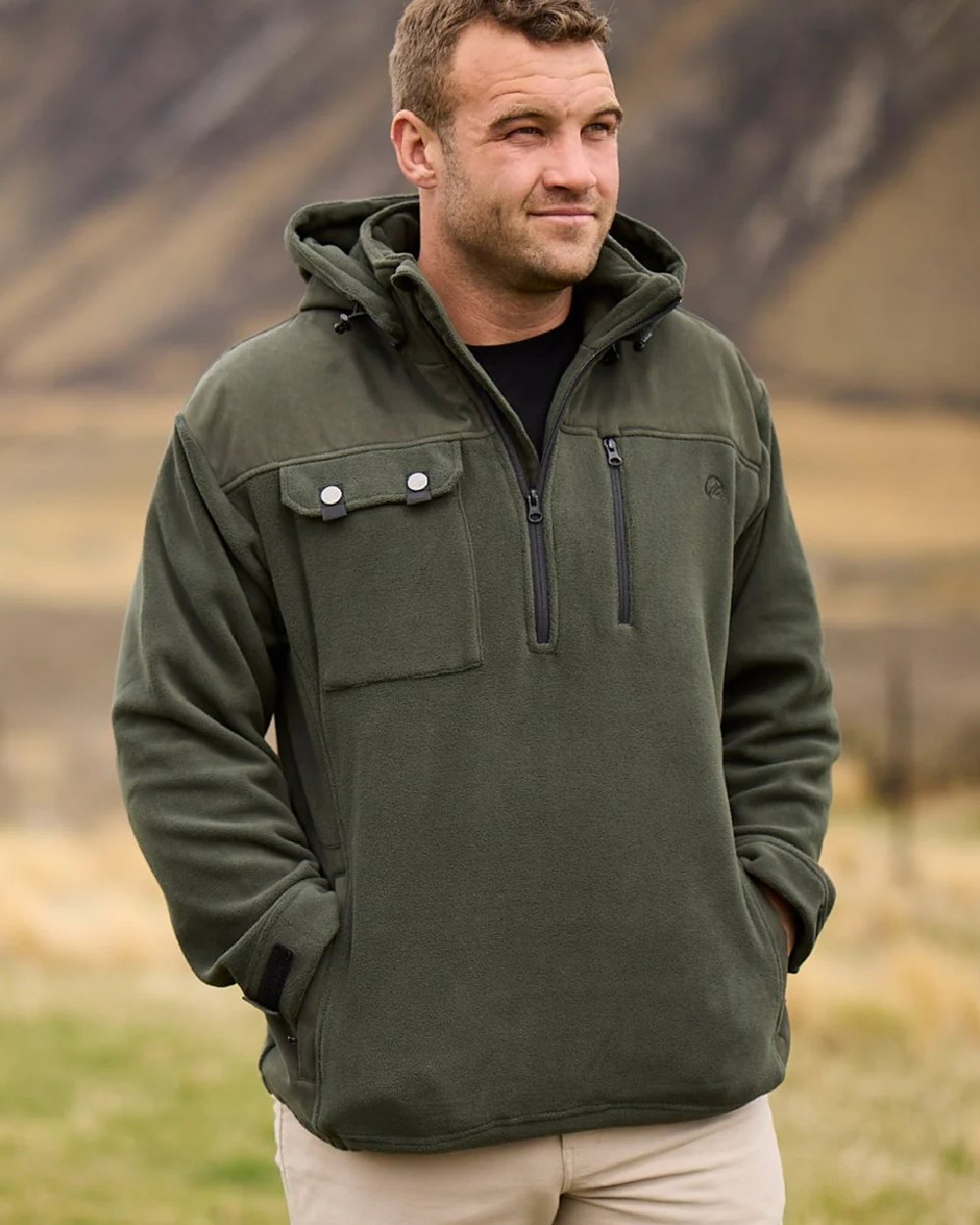 Olive Coloured Swanndri Mens High Rock Technical Fleece Hoodie on mountain background 