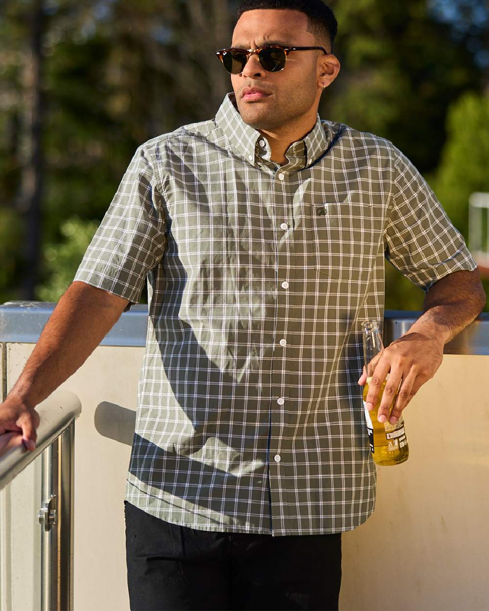 Olive Check Coloured Swanndri Mens Lancewood Short Sleeve Shirt on blurry background 