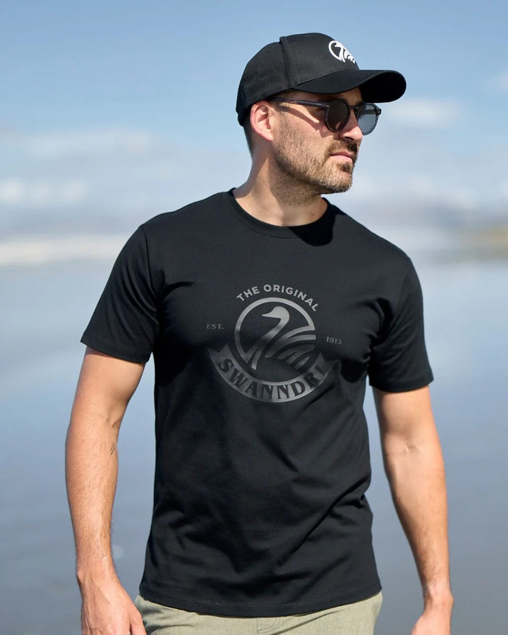 Black Coloured Swanndri Mens Original V2 T-Shirt on sky background 