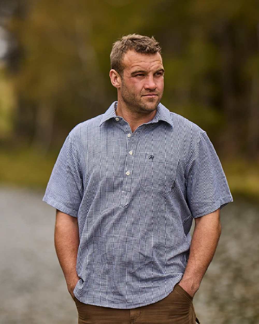 Navy White Check Coloured Swanndri Mens Paihia Short Sleeve Shirt on blurry background 