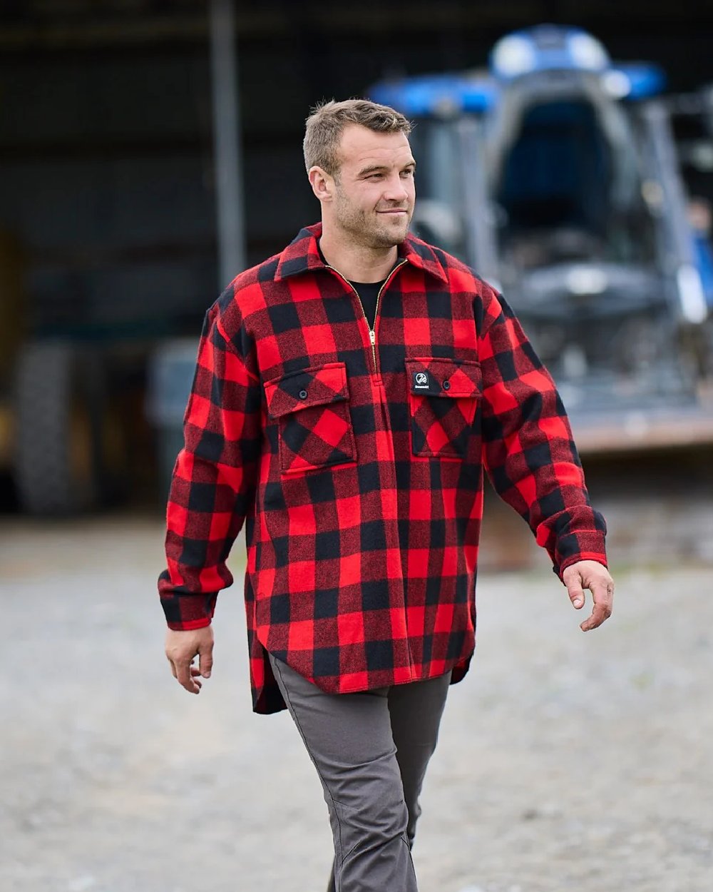 Red Black Check Coloured Swanndri Mens Ranger Wool Zip Front Bushshirt on blurry background 