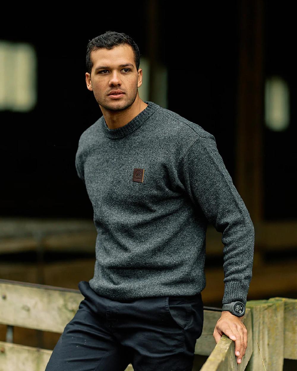 Charcoal Marle Coloured Swanndri Mens Seafarer Wool Crew Neck Jersey on blurry background 