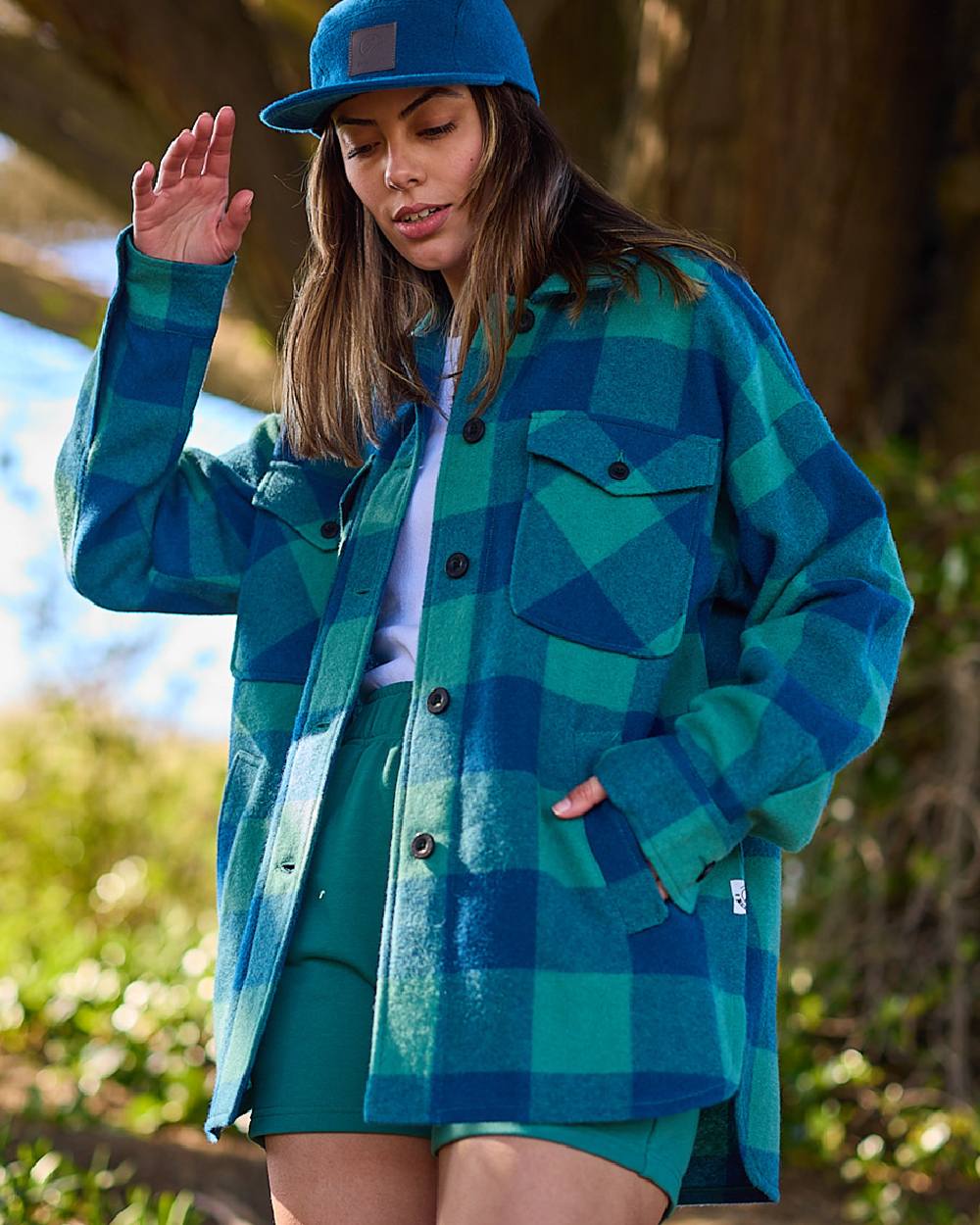 Coastal Check Coloured Swanndri Womens Harbourage Lite Wool Shacket on forest background 