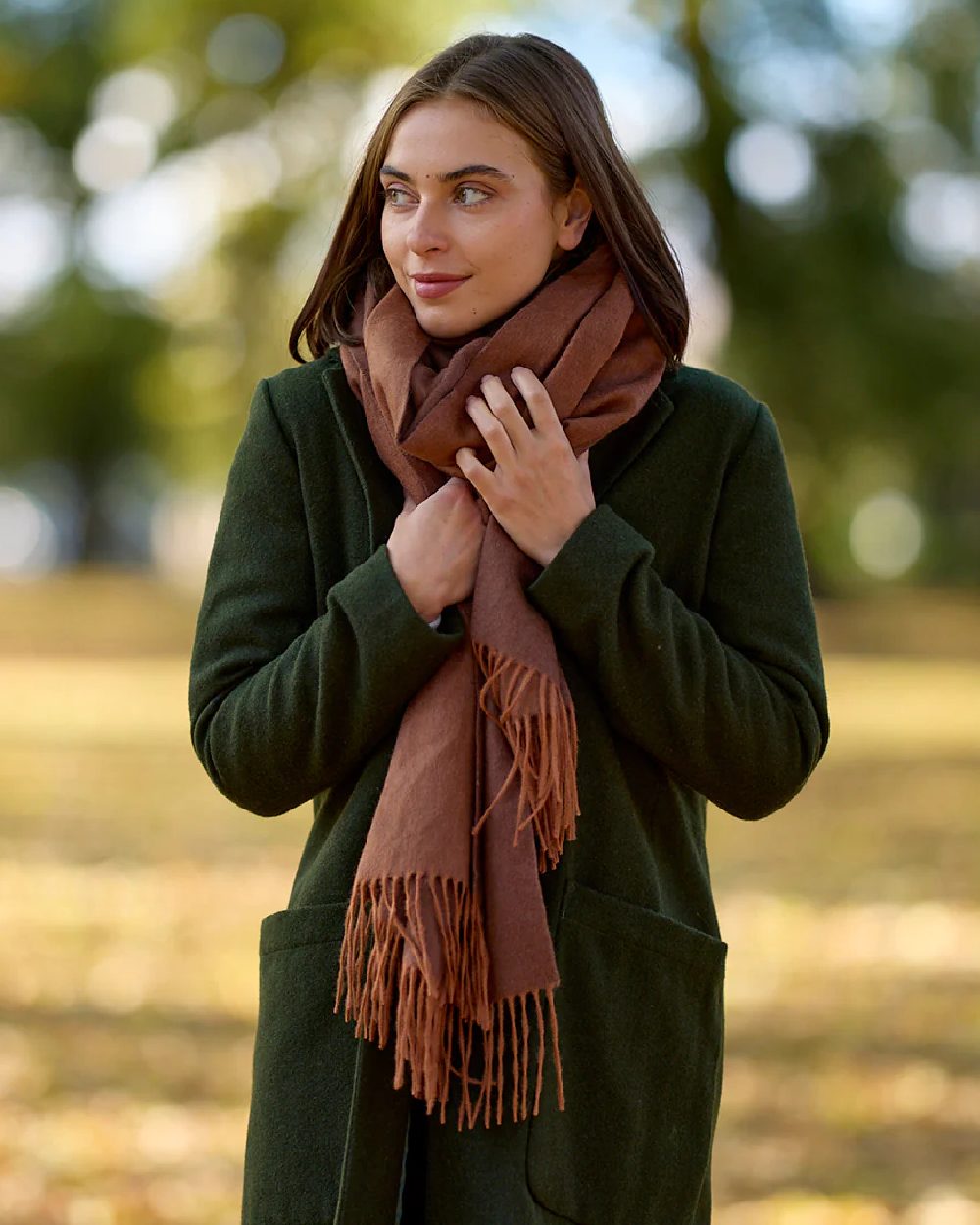 Rusty Coloured Swanndri Womens Wide Scarf on outdoor background 