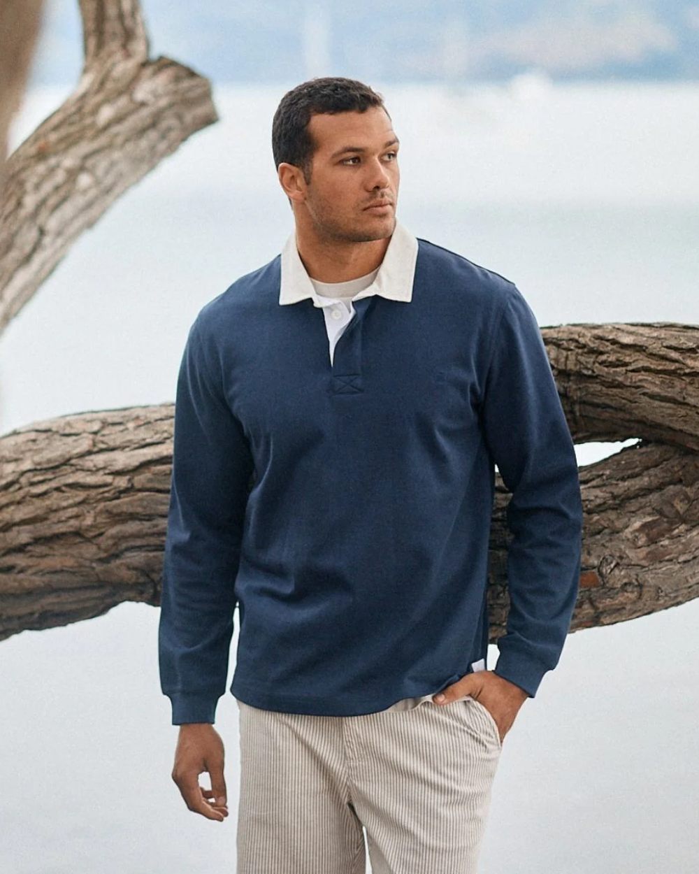 Navy coloured Swanndri Mens Fundamentals Long Sleeve Rugby Top on outdoor background 