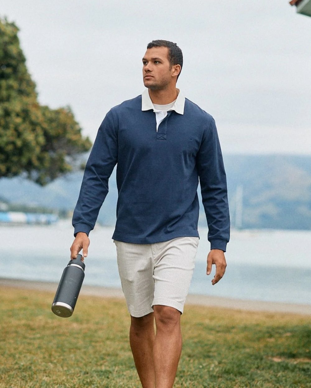 Navy coloured Swanndri Mens Fundamentals Long Sleeve Rugby Top on outdoor background 