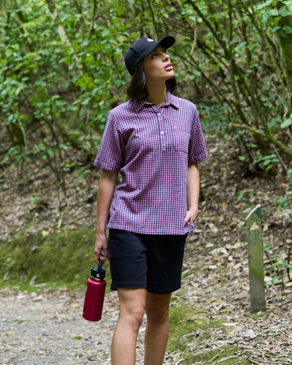 Navy coloured Swanndri Womens Blumont Stretch Canvas Shorts on forest background 