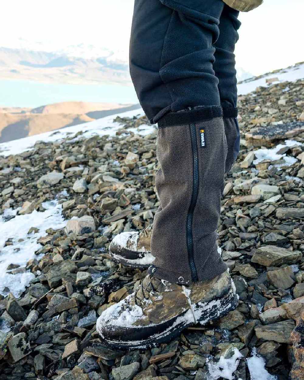 Black Coloured Swazi Ali-Gaiters on outdoor background 