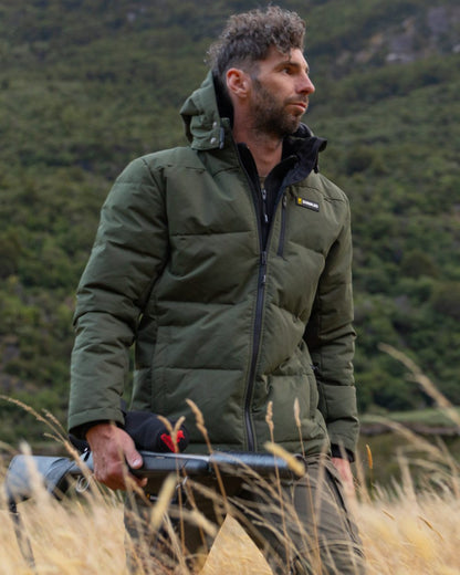 Olive coloured Swazi Mens Jack Frost Insulation Jacket on forest background 
