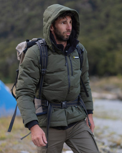 Olive coloured Swazi Mens Jack Frost Insulation Jacket on forest background 