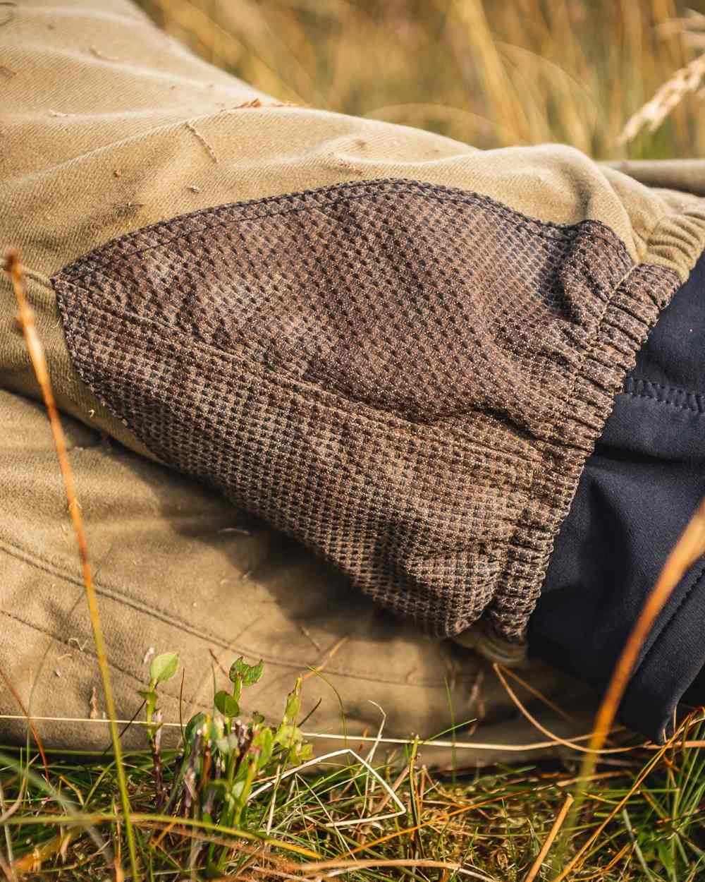 Tussock Green Coloured Swazi Overpants on outdoor background 