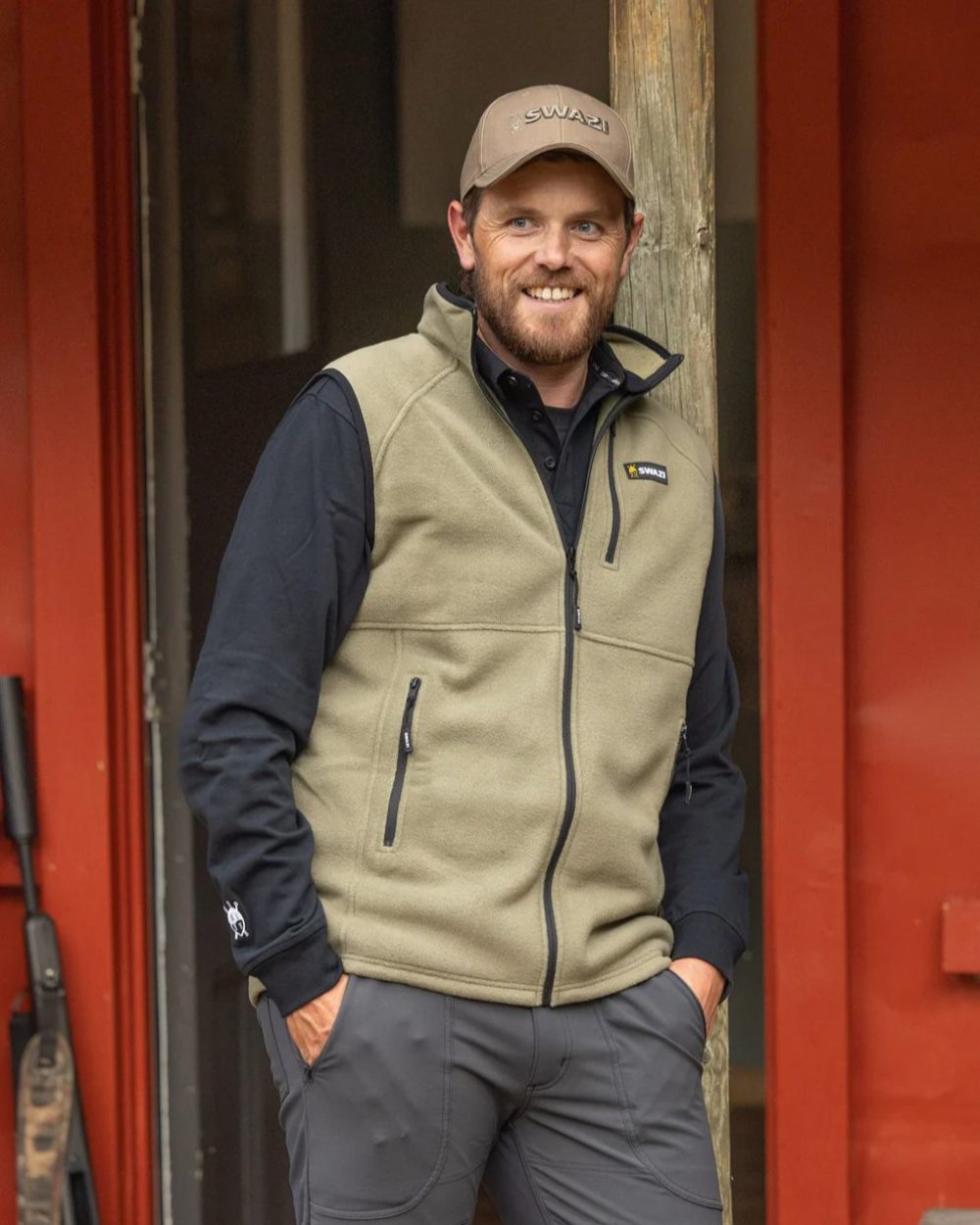 Tussock Coloured Swazi Sherpa Vest On A blurry Background 