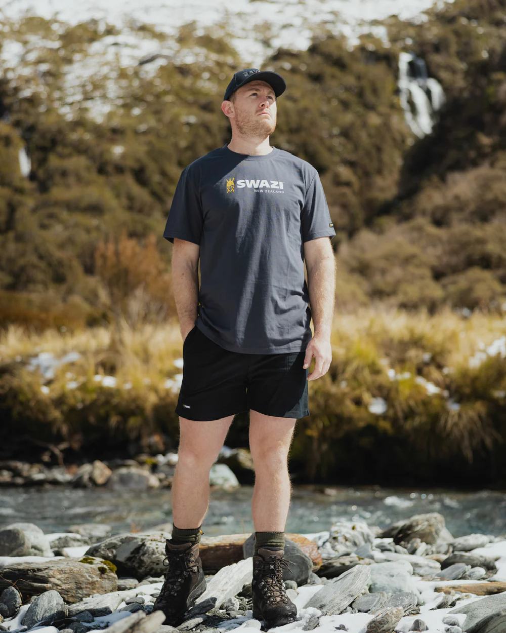 Granite Coloured Swazi Tee on forest background 