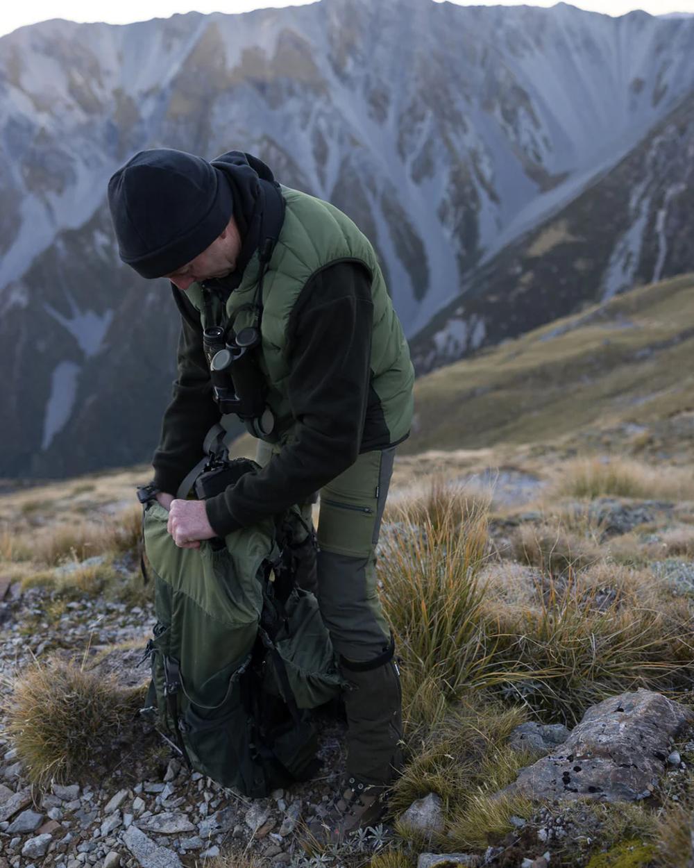 Olive coloured Swazi Thorso Vest on mountain background 