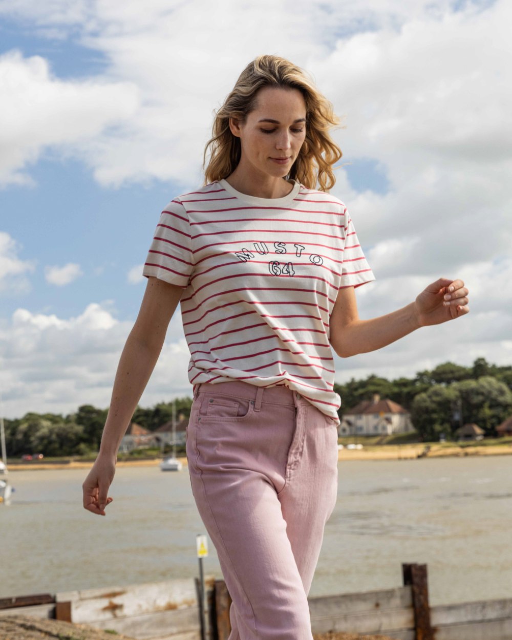 Sweet Raspberry/ASW Coloured Musto Womens Classic Striped Short Sleeve T-Shirt On A Beach Background 