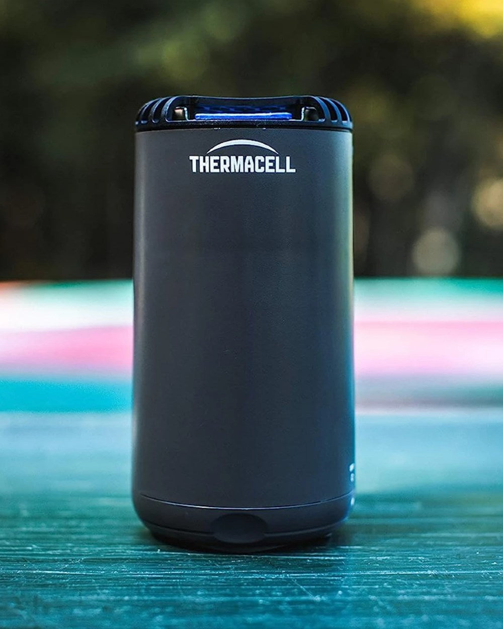 Graphite coloured Thermacell Halo Mini Protector on pool background 