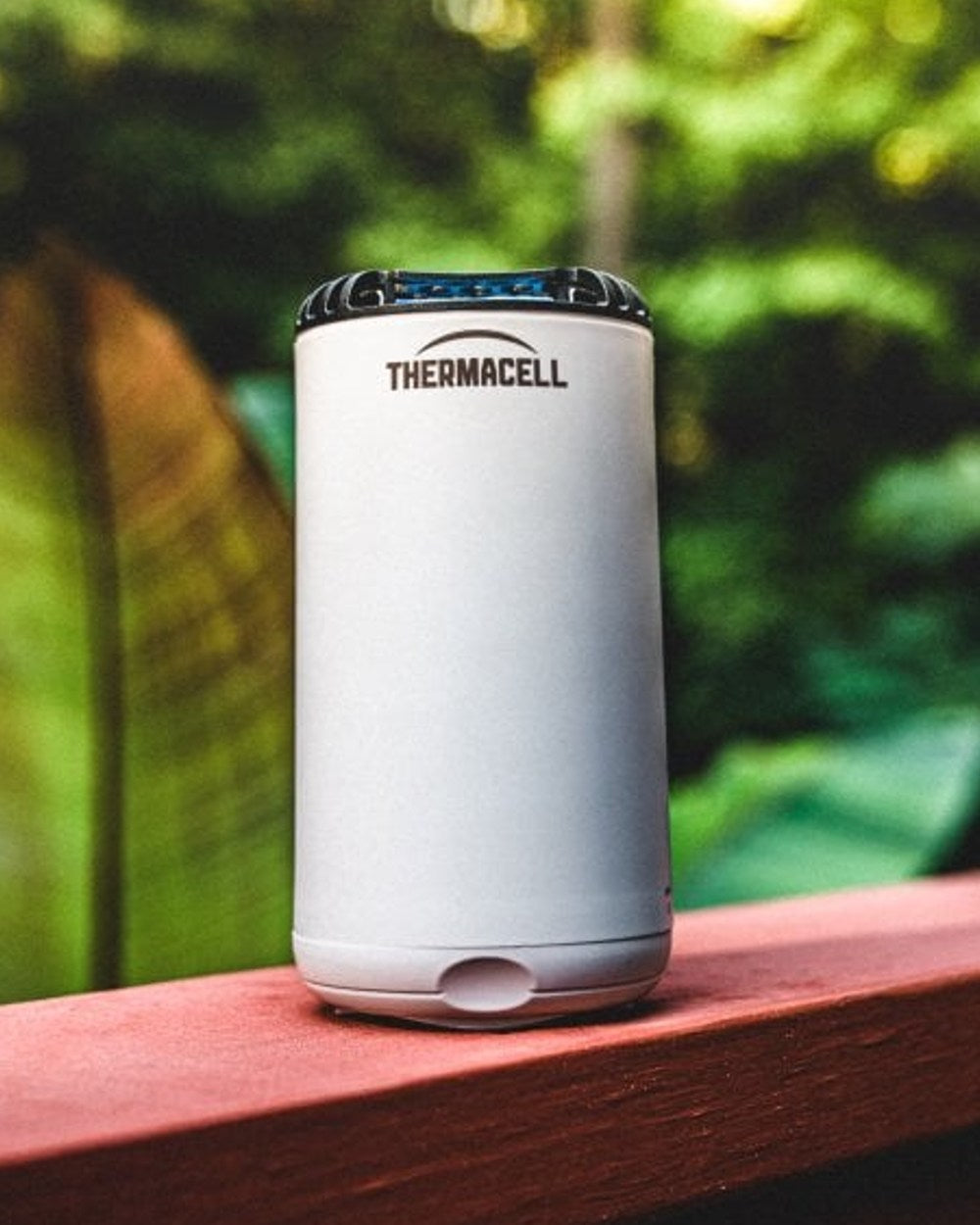 White coloured Thermacell Halo Mini Protector on a forest background 