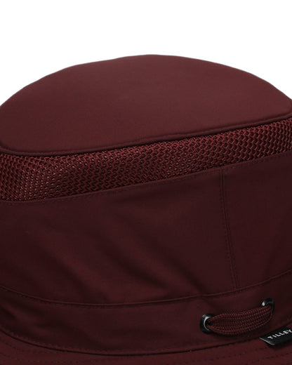 Mulberry coloured Tilley Hats Airflo Broad Brim Sun Hat  on white background 