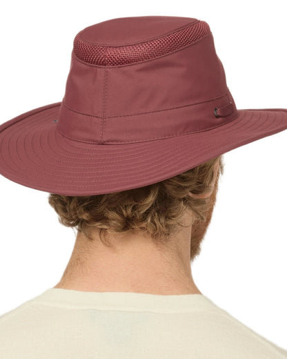 Mulberry coloured Tilley Hats Airflo Broad Brim Sun Hat  on white background 