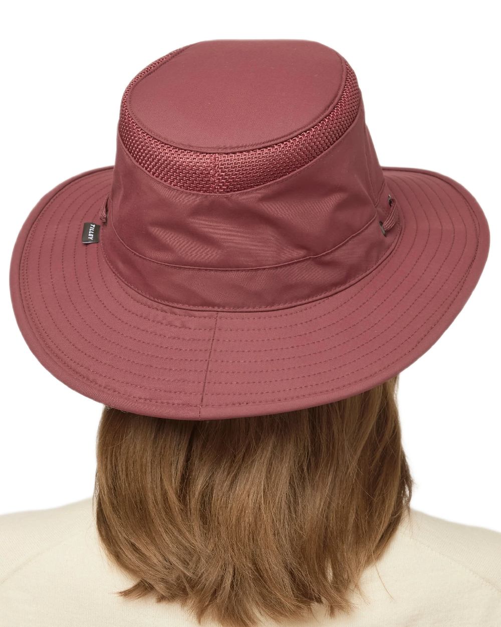 Mulberry Coloured Tilley Airflo Medium Brim Recycled Hat on white background 