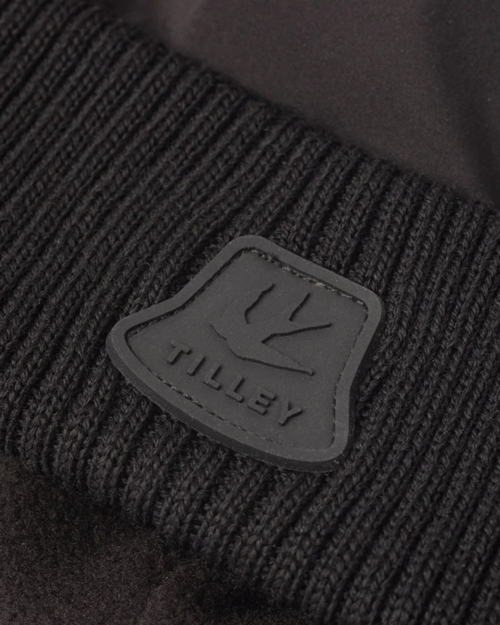 Black coloured Tilley Airlite Down Padded Beanie on white background 