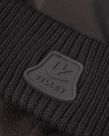 Black coloured Tilley Airlite Down Padded Beanie on white background 