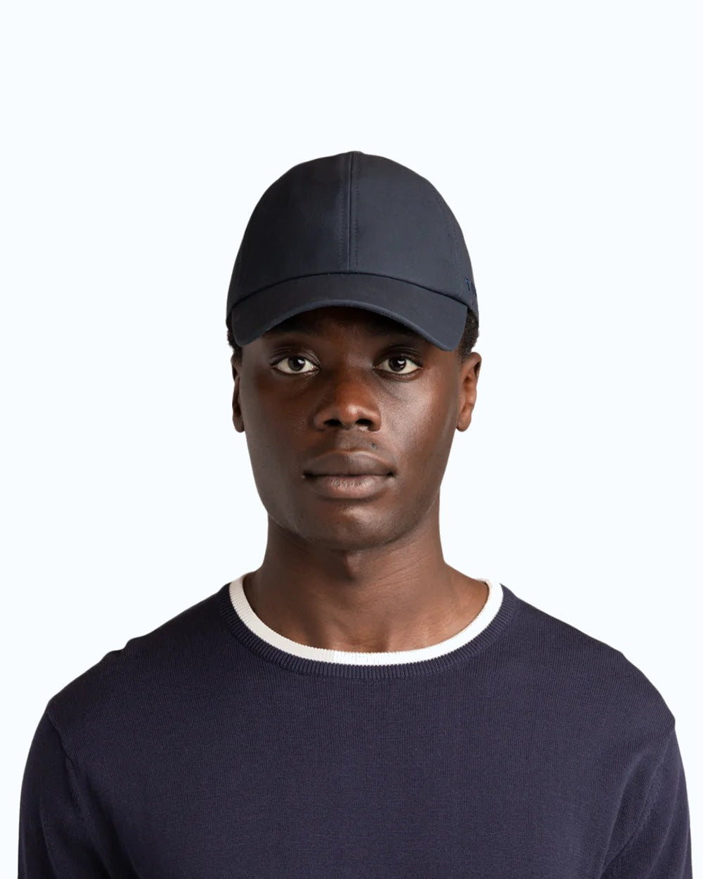 Navy Coloured Tilley Hats Waxed Baseball Cap On A White Background 