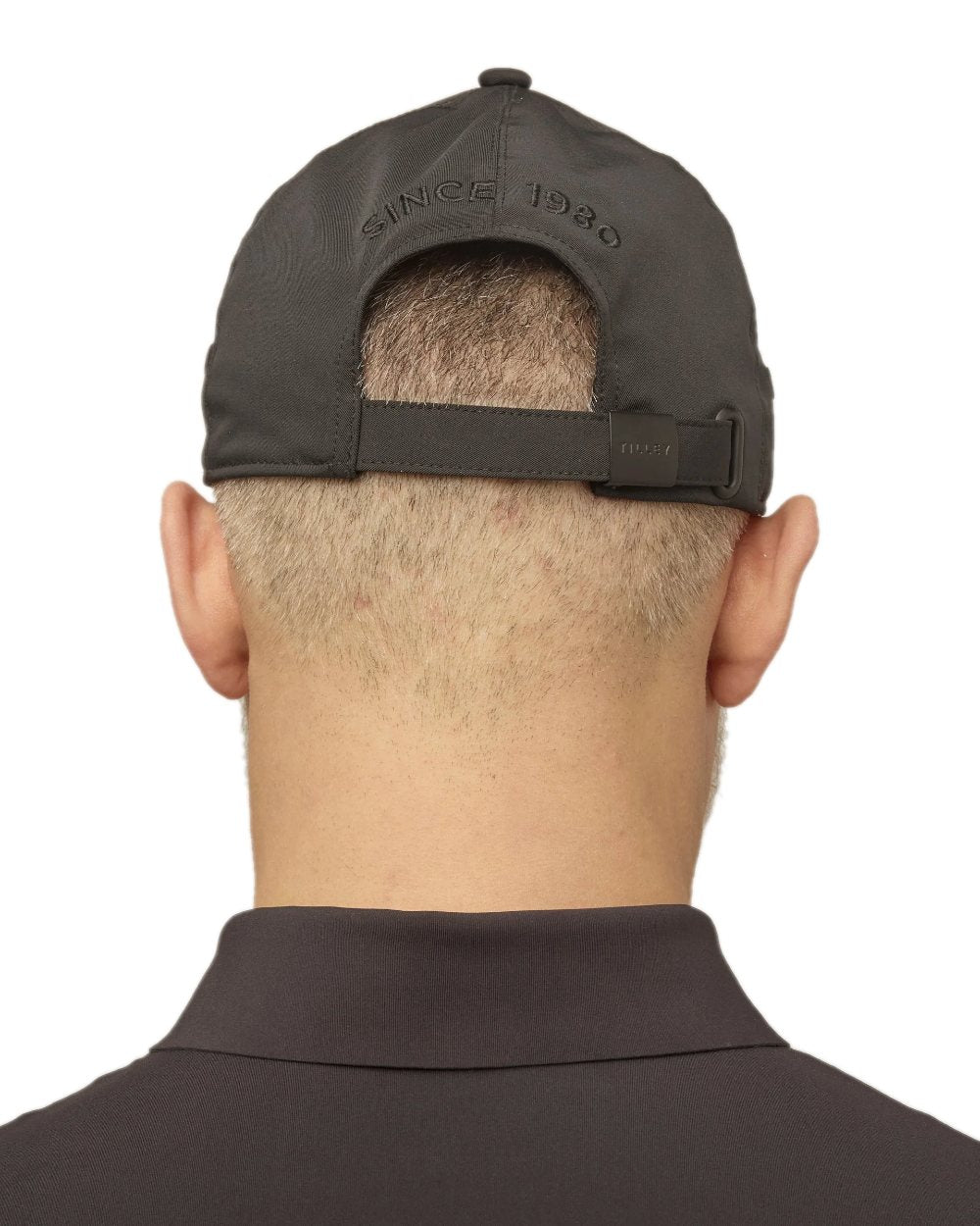 Black Coloured Tilley New Tech Travel Cap on white background 