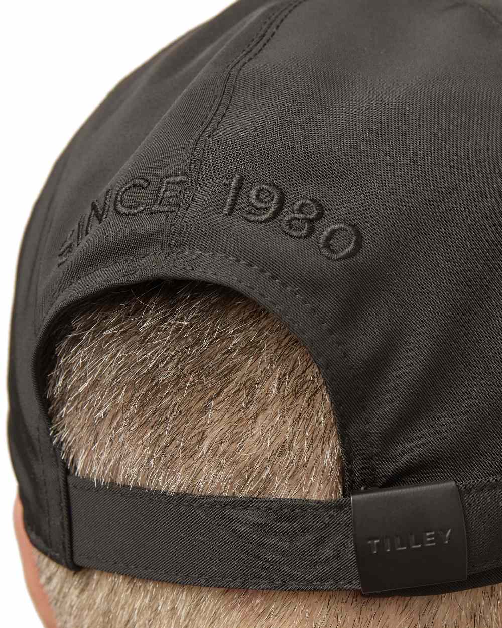 Black Coloured Tilley New Tech Travel Cap on white background 