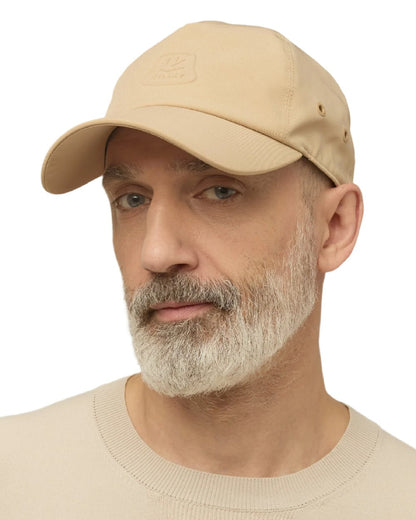 Safari Tan Coloured Tilley Travelers Cap on white background 
