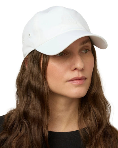 White Coloured Tilley New Tech Travel Cap on white background 