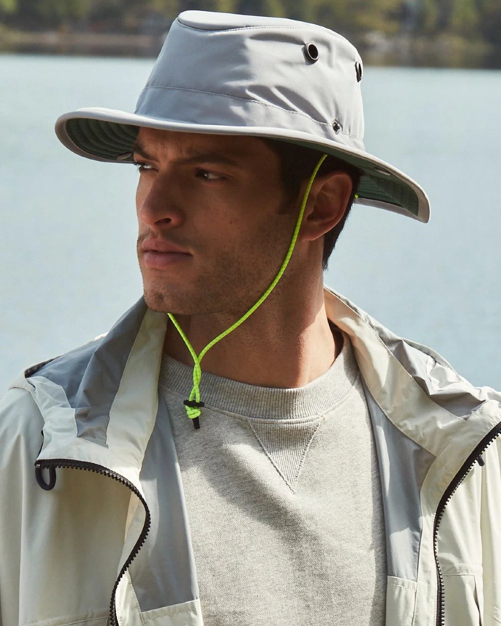 Grey Green coloured Tilley TWS1 All Weather Hat on sea background 