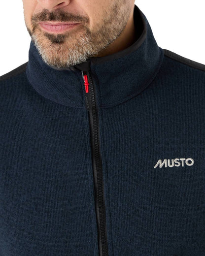 True Navy Marl Coloured Musto Mens Knitted Fleece On A White Background 