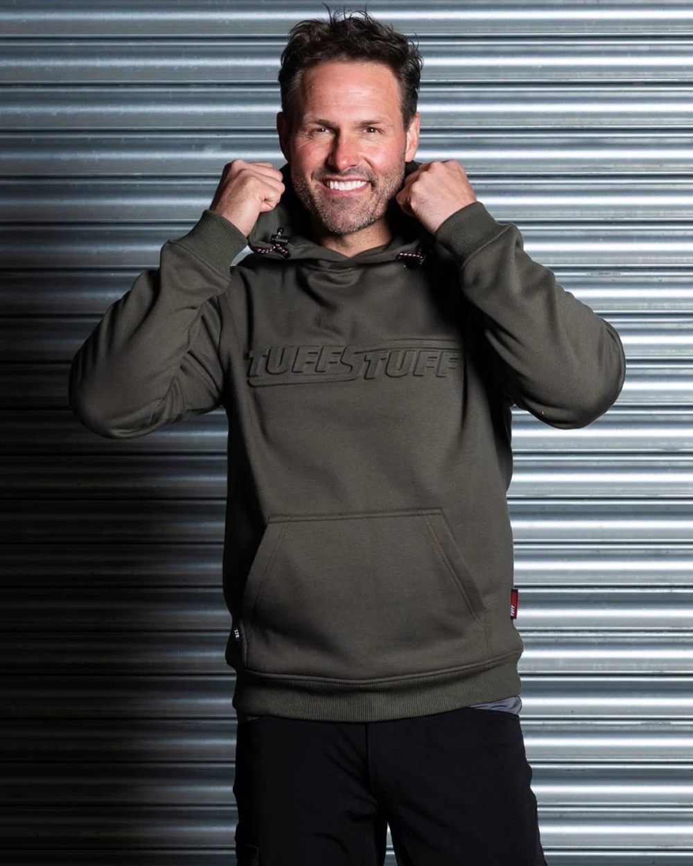 Green coloured TuffStuff Mens Embossed Hoodie on outdoor background 