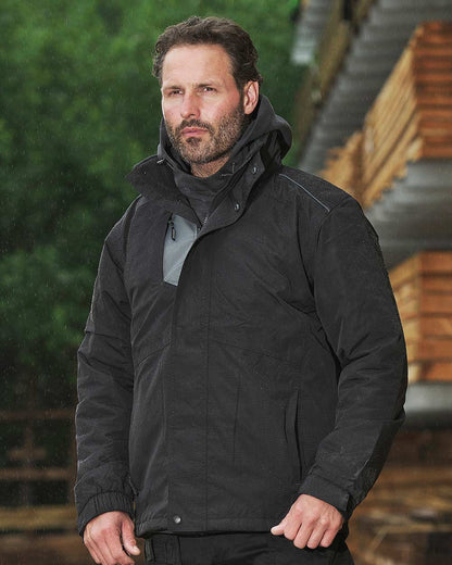 Man in the rain wearing TuffStuff Newport Jacket in black  