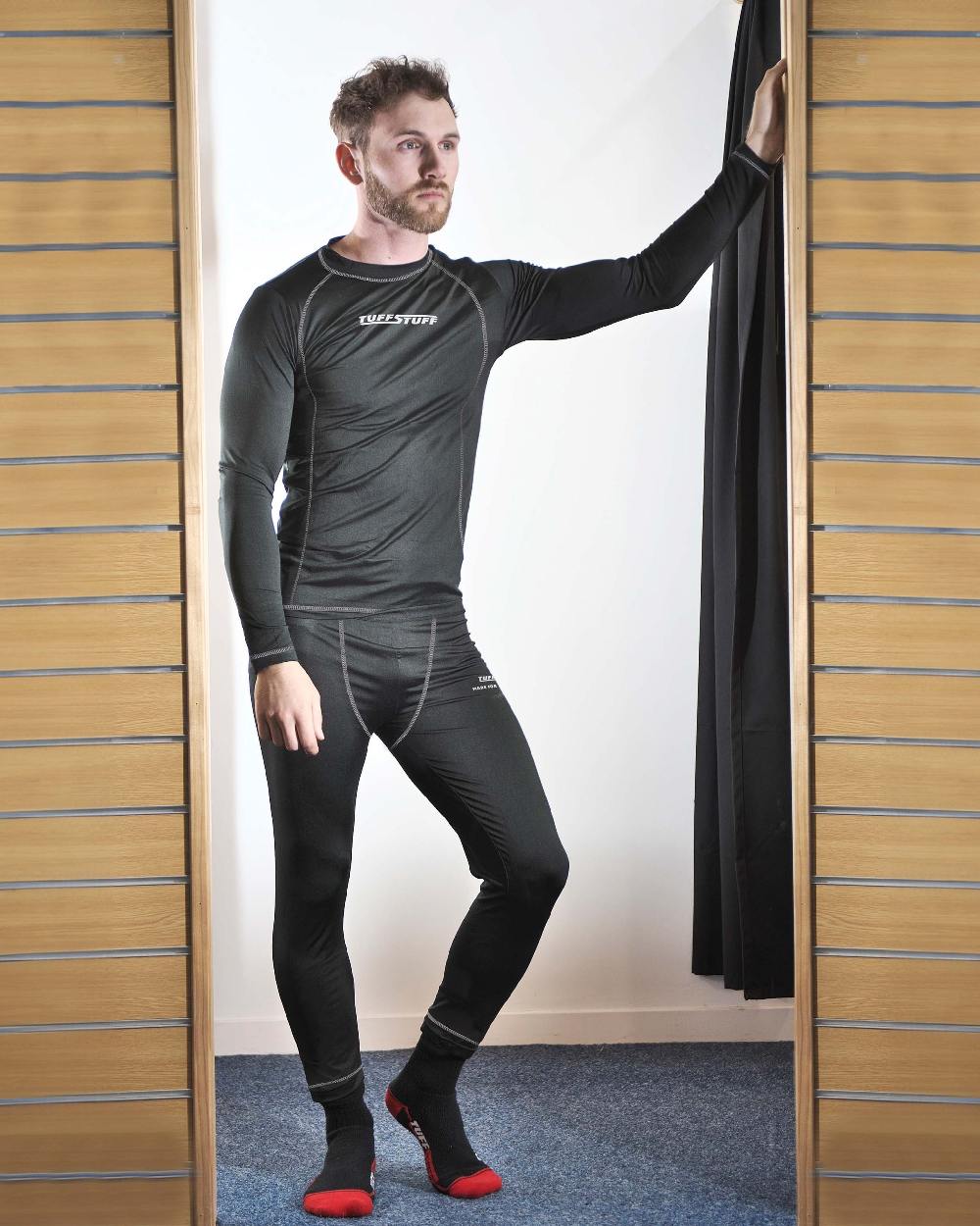 Black Coloured TuffStuff Basewear Bottoms On A Fitting Room Background