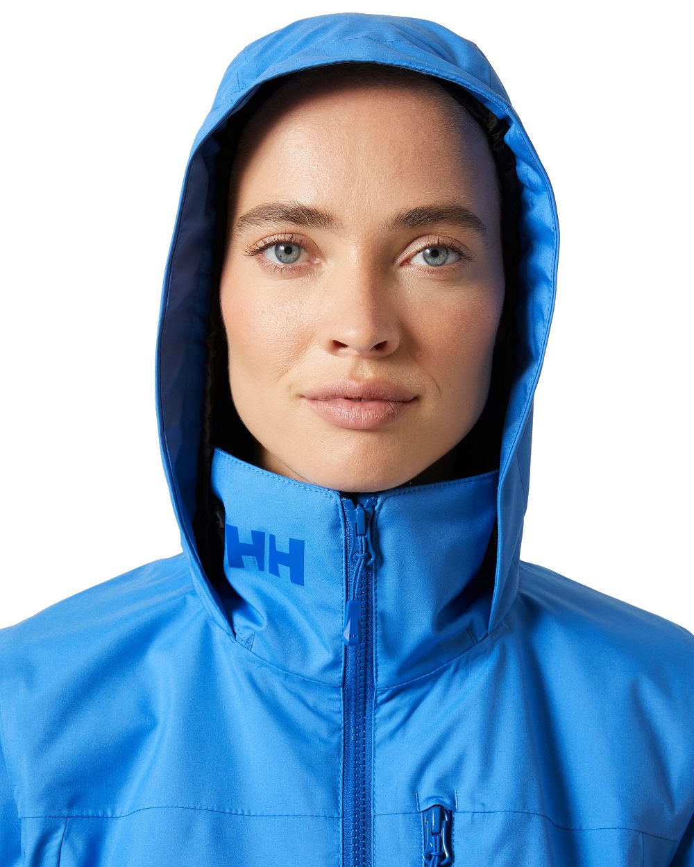 Ultra Blue coloured Helly Hansen womens crew hooded sailing jacket 2.0 on white background 