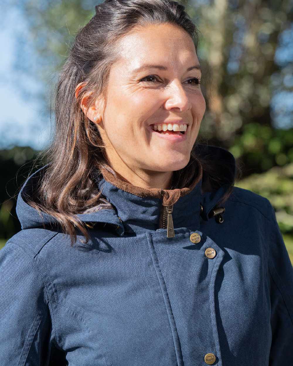 Navy Blue Coloured Baleno Harmony Waterproof Coat on blurry background 