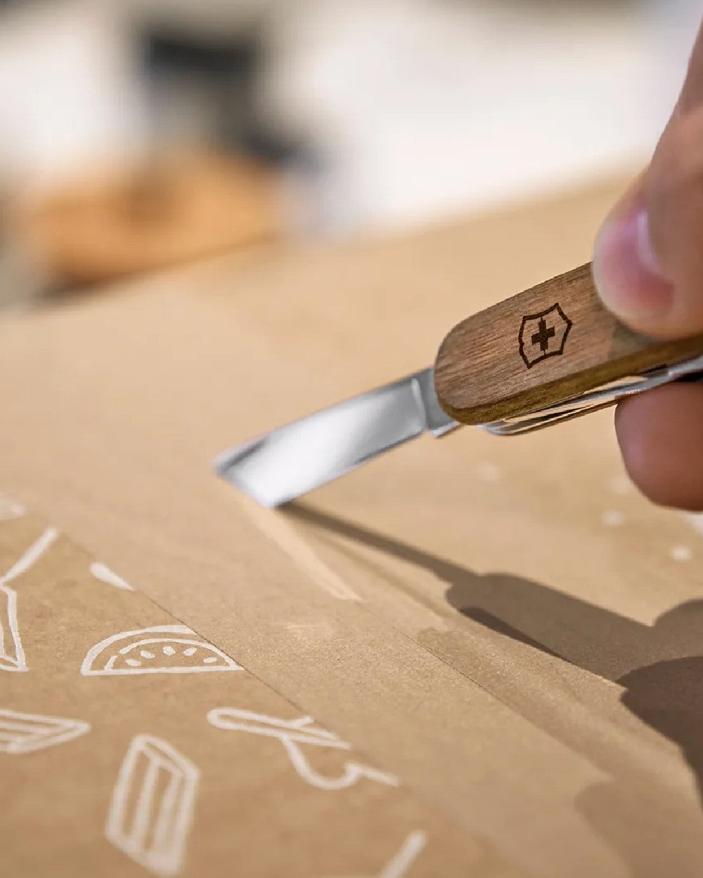 Walnut Wood Coloured Victorinox Spartan Wood Swiss Army Pocket Knife on blur background 